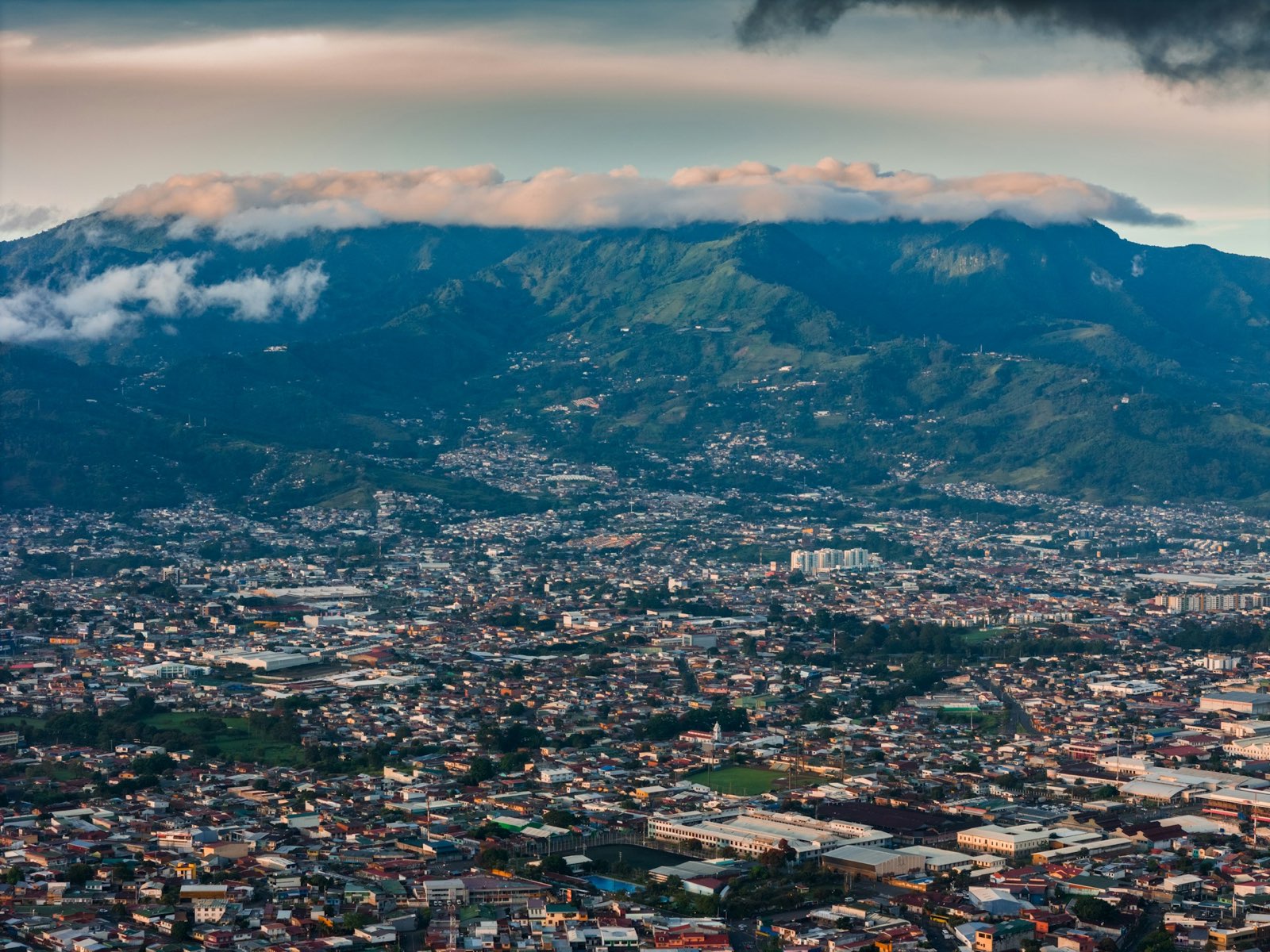 Costa Rica's Central Valley with green mountains and scattered clouds