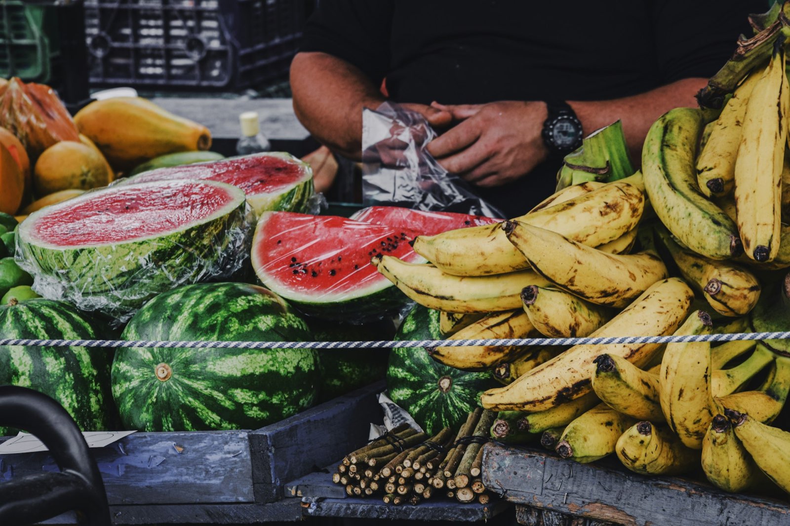 A vibrant roadside stand selling fresh tropical fruits in Costa Rica